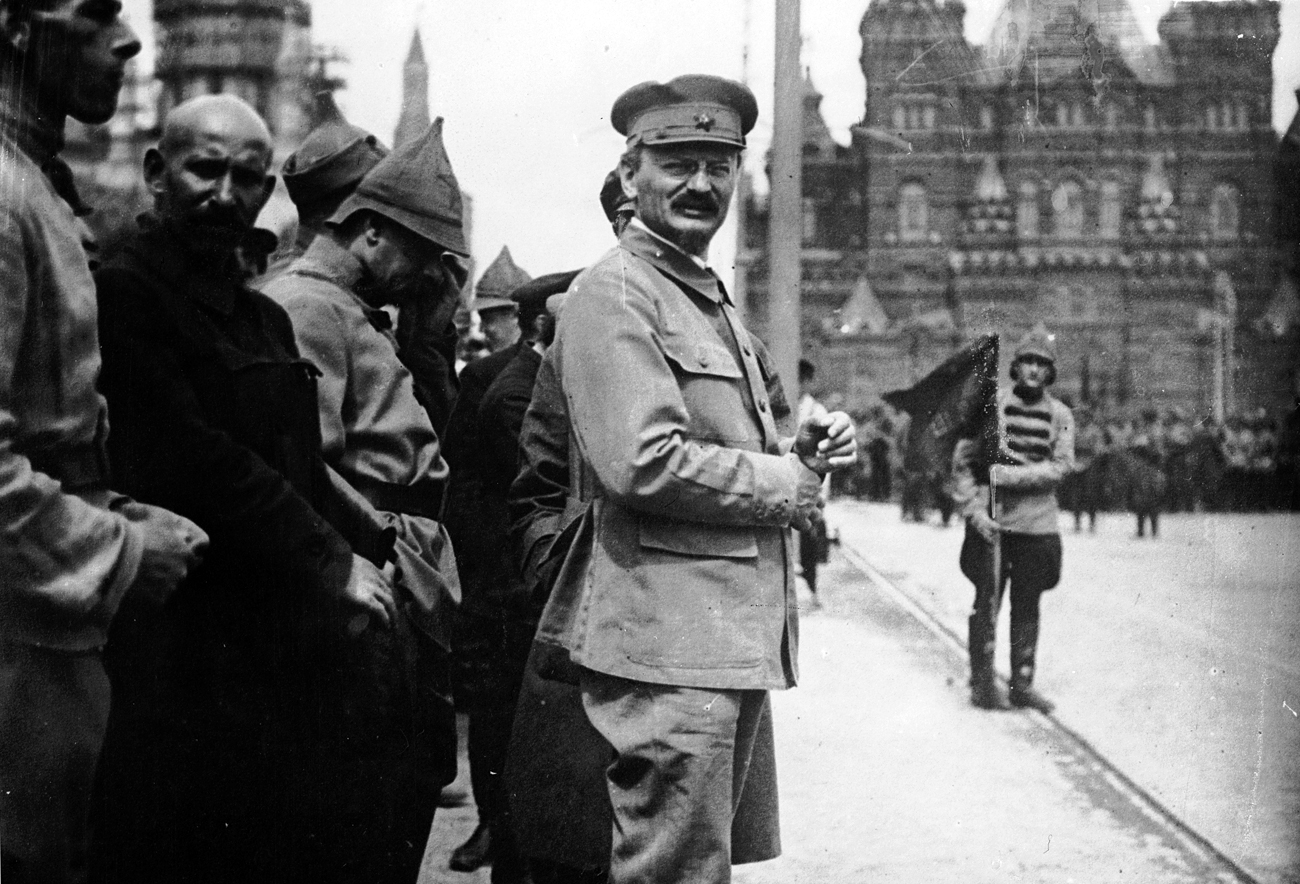 1918: Leon Trotsky attends a parade in Red Square, Moscow, as Lenin reviews his troops.
