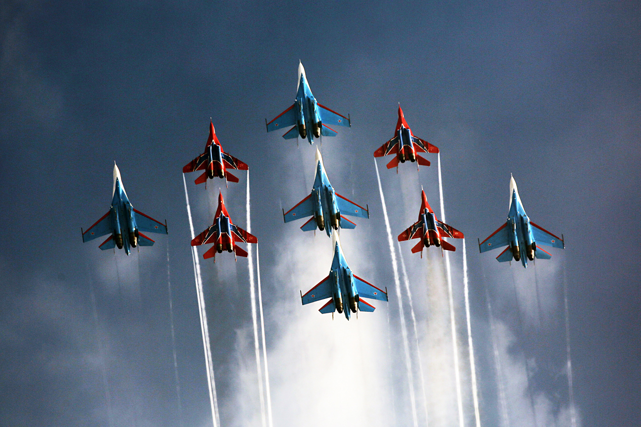 Mikoyan Mig 29 fighter jets of the Strizhi  aerobatic team and Sukhoi Su 27 fighter jets of the Russkiye Vityazi 