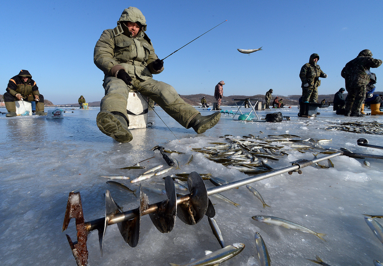 Fishermen during ice fishing in Vladivostok.