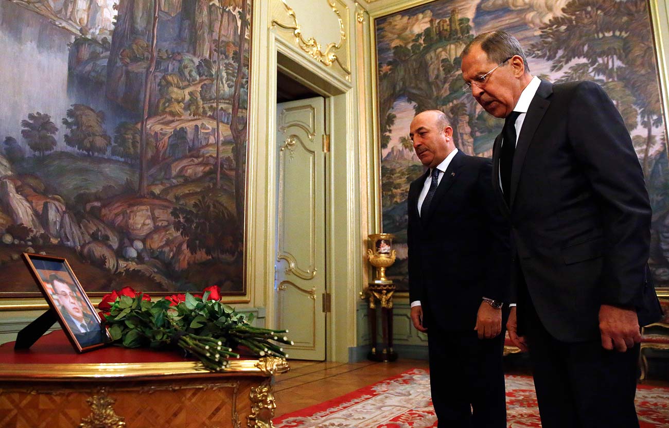 Russian Foreign Minister Sergei Lavrov (R) and his Turkish counterpart Mevlut Cavusoglu attend a ceremony in memory of murdered Russian ambassador to Turkey Andrei Karlov before their talks in Moscow, Russia.
