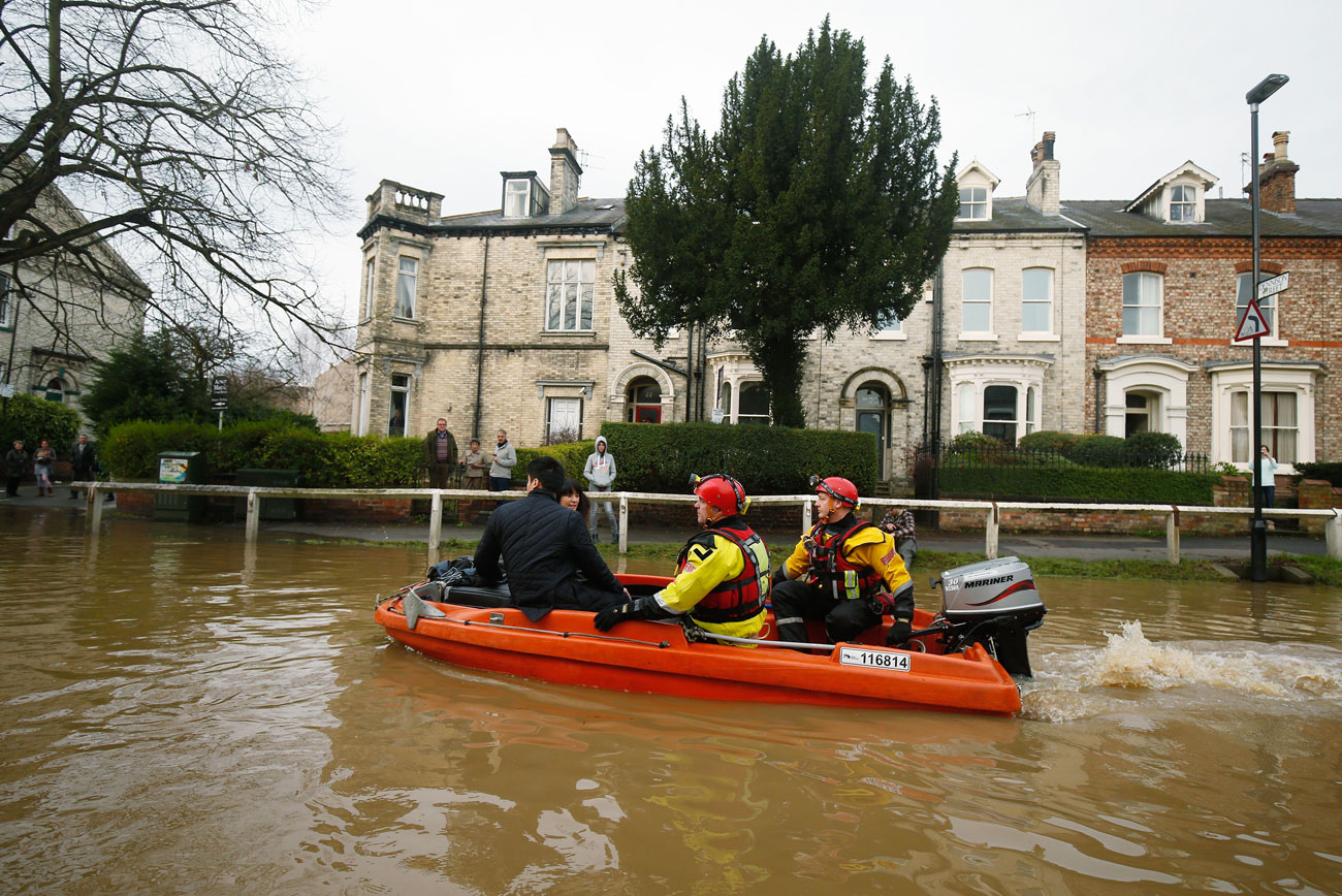 Turning the tide: urgent action on climate change is necessary to help prevent global flooding events, such as this one in the UK last December.