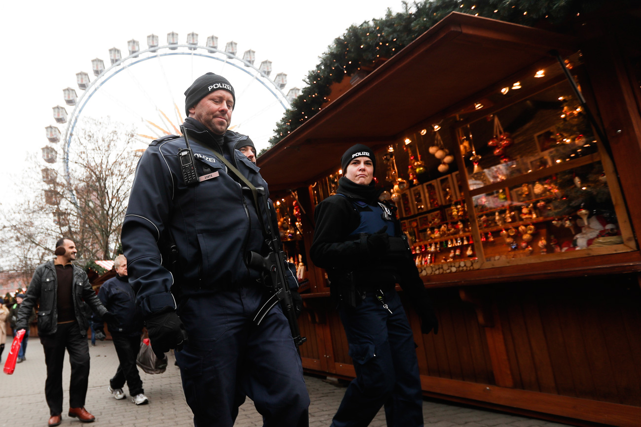 Police officers patrol over a Christmas market near the city hall in Berlin on Dec. 21, 2016, two days after a truck ran into the crowded Christmas market at the Breitscheidplatz in the city and killed several people.