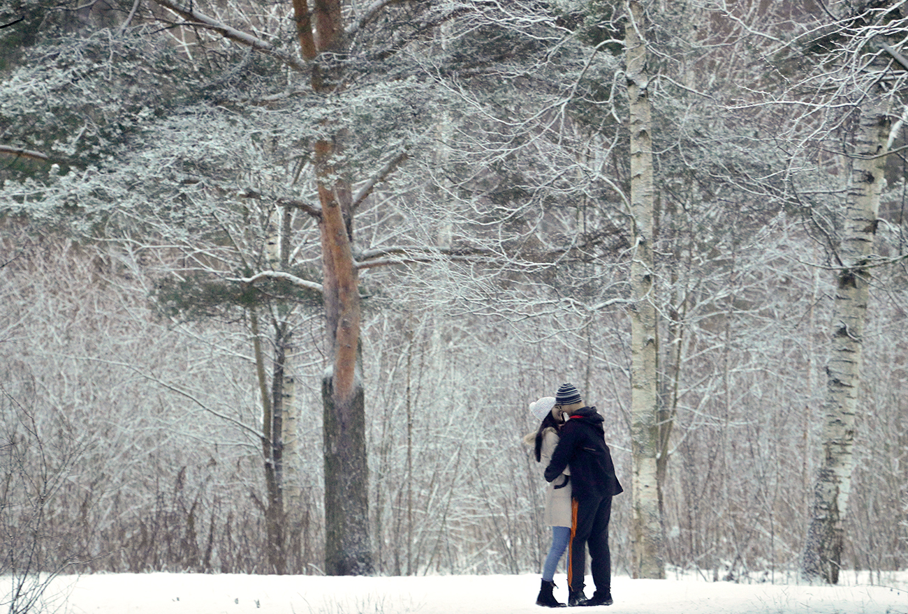 A tender moment in a snowbound park in St. Petersburg.