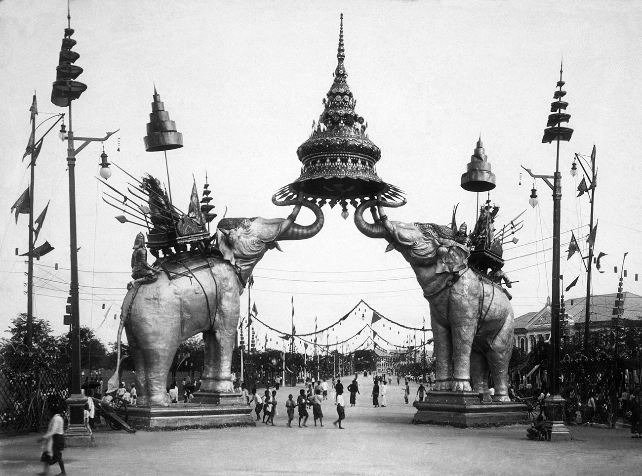 Two huge elephants carrying seats form a triumphal arch in Bangkok, Thailand. It was built in honour of the late Chulalongkorn, king of Siam, who visited Europe in 1897