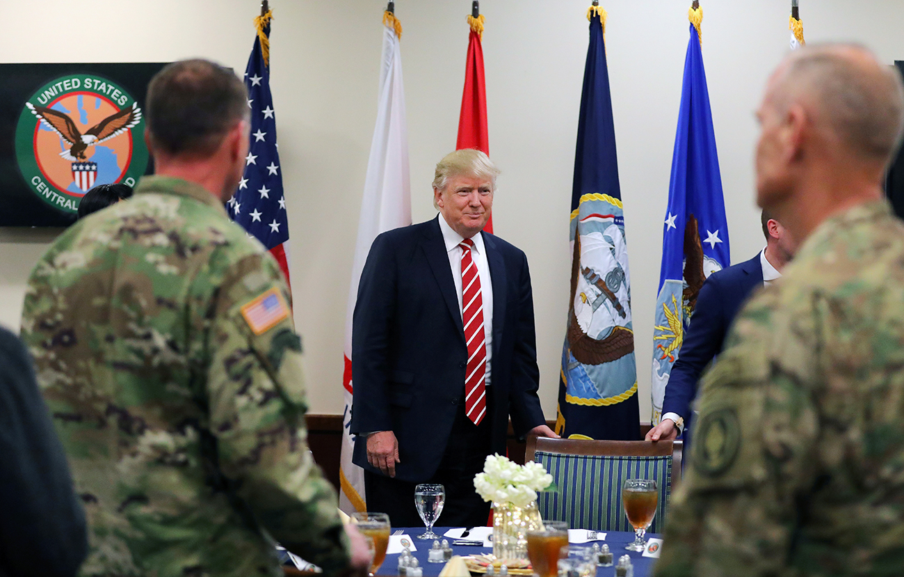 "Trump will see to it if to bring Crimea and Ukraine as part of the discussion, but he will not be fixated on that." Photo: President Trump attends a lunch with members of the U.S. military.