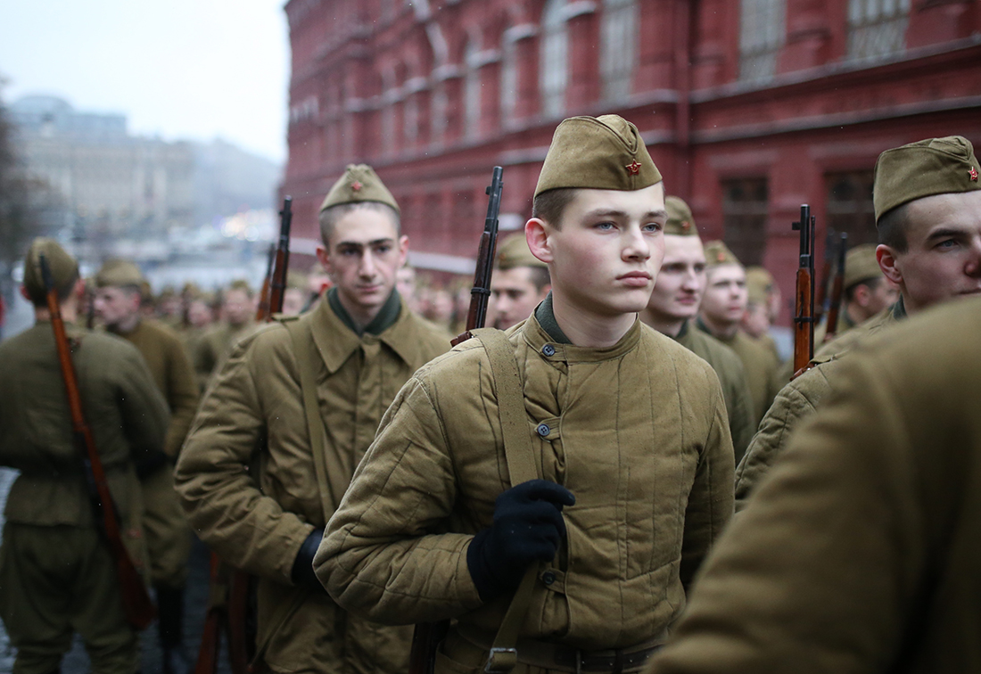 Participants dressed as Red Army soldiers march through Red Square during a military parade
