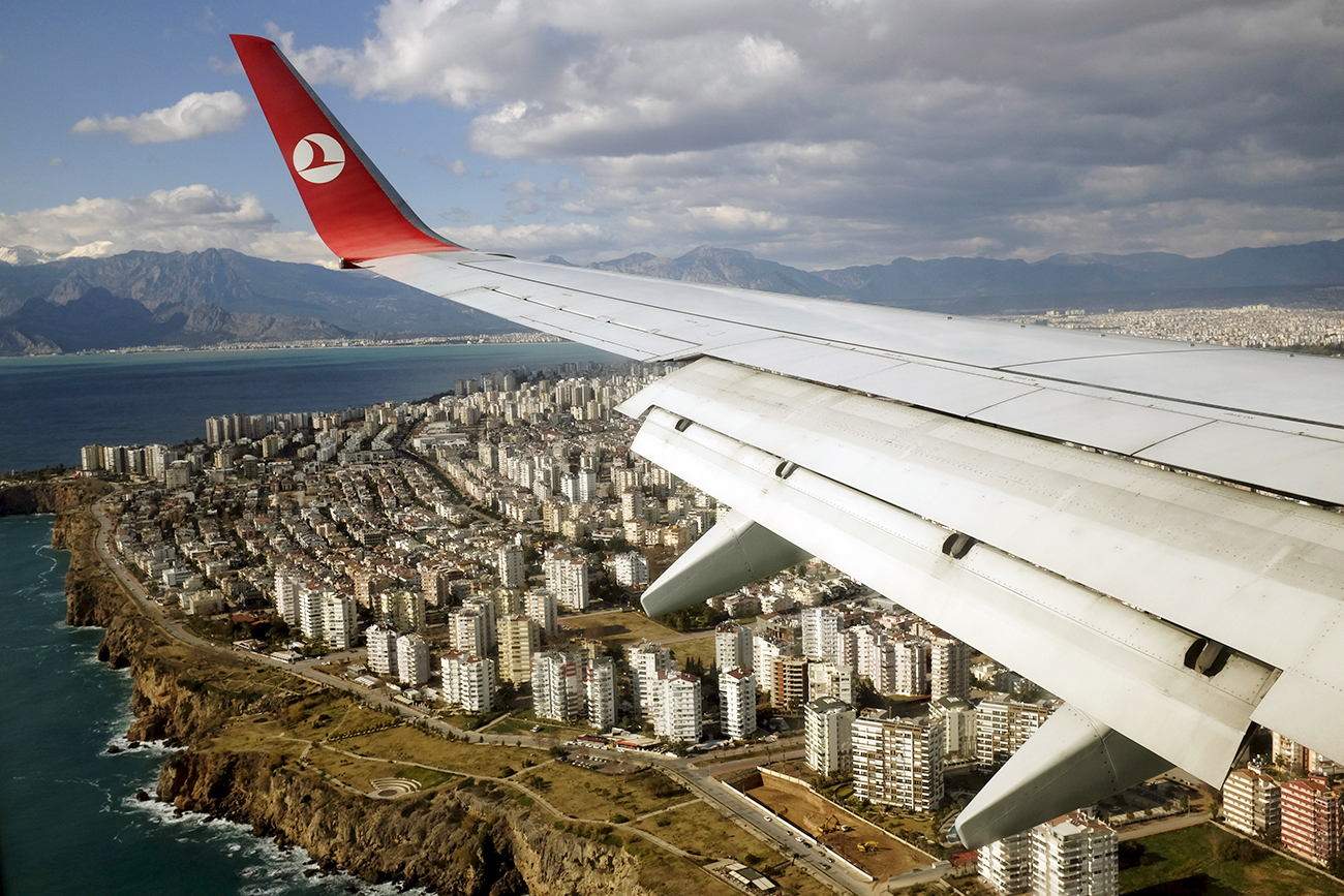 A Turkish Airlines Boeing 737-800 aircraft approaches to land at Antalya International airport in the Mediterranean resort city of Antalya, Turkey.