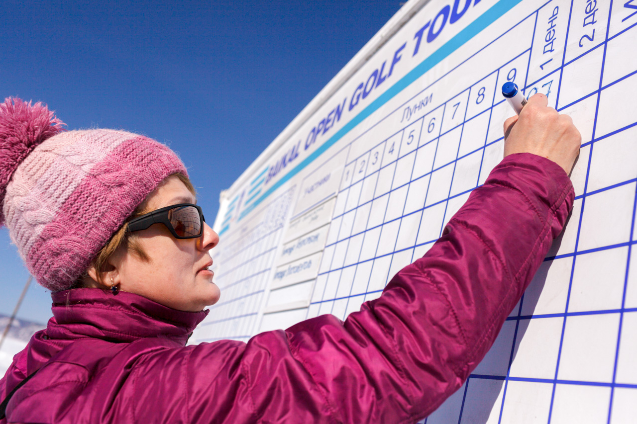 Ice golf competitions take place near Listvyanka, a small settlement 70 km from Irkutsk, surrounded by forest tracts and misty mountain peaks on a strip of land dotted with assorted huts and houses, stretching for 5 km along the shore of Lake Baikal. The only river flowing out of Baikal—the Angara—is an hour’s drive away.