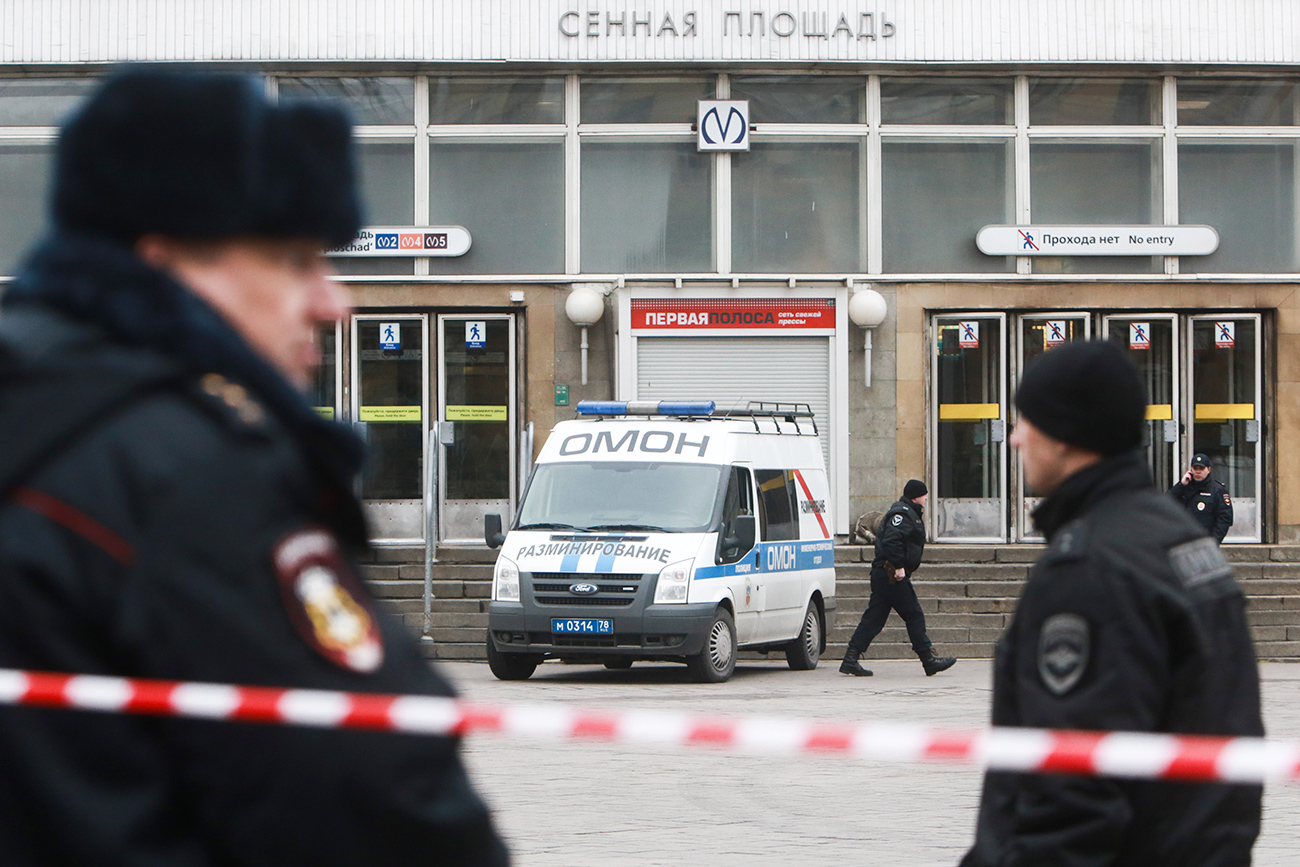 Law enforcement officers near Sennaya Ploshchad station of the St Petersburg metro in the aftermath of an explosion.