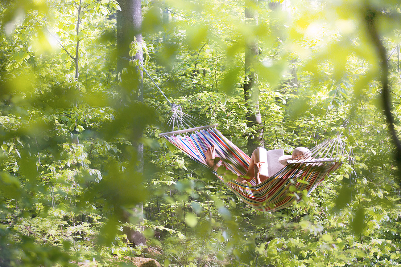 Girl reading in hammock