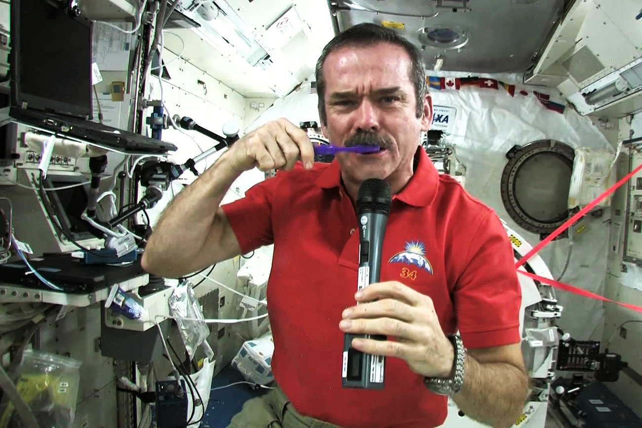 Chris Hadfield brushes his teeth in space.