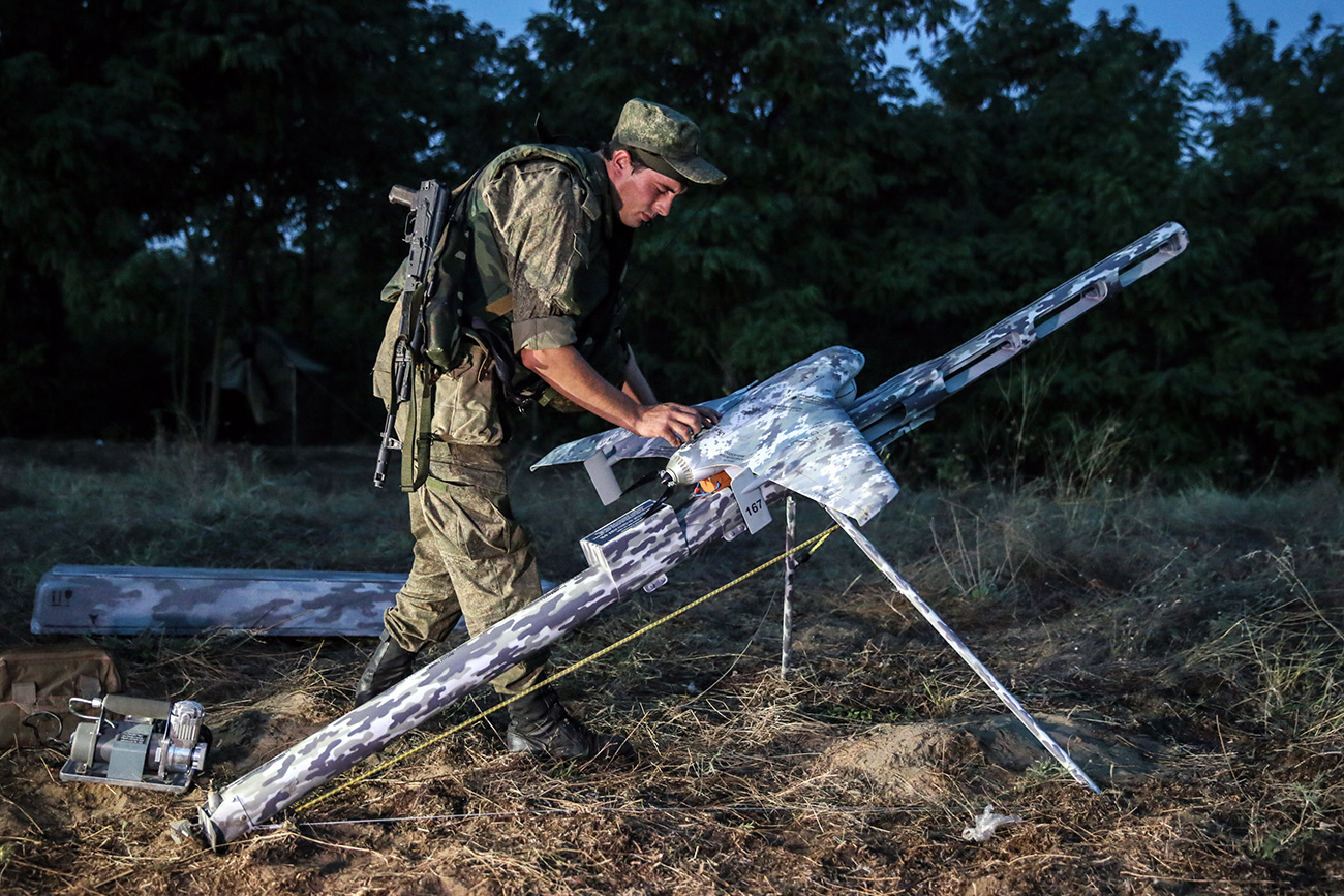 "Software has been developed to allow a group of six aerial vehicles to be controlled simultaneously." Photo: An air drone being launched during tactical exercises held by motorized infantry units of Russia's Southern Military District.