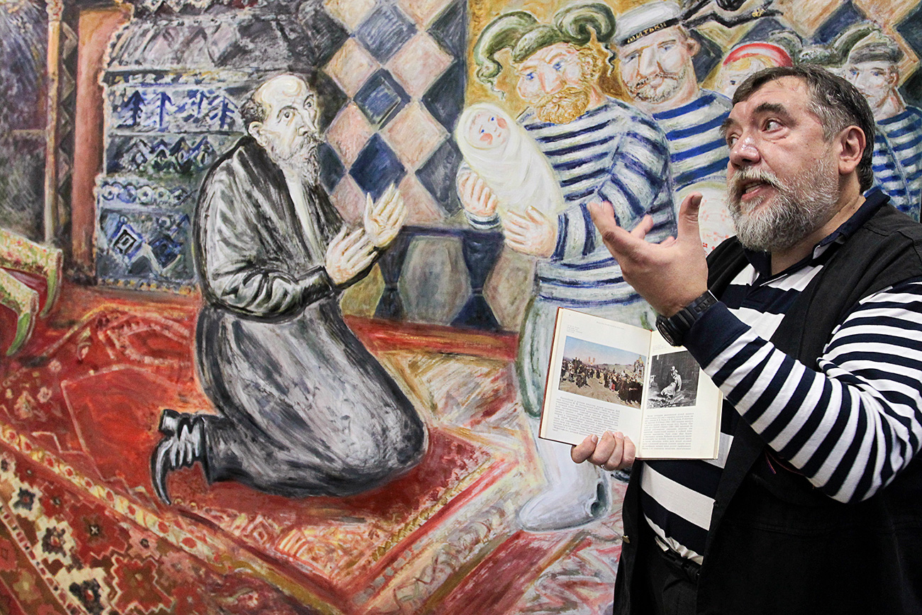 Dmitry Shagin and "Mitki Bring New Son to Ivan the Terrible" painting, at the Mitki-Art art center in St. Petersburg.