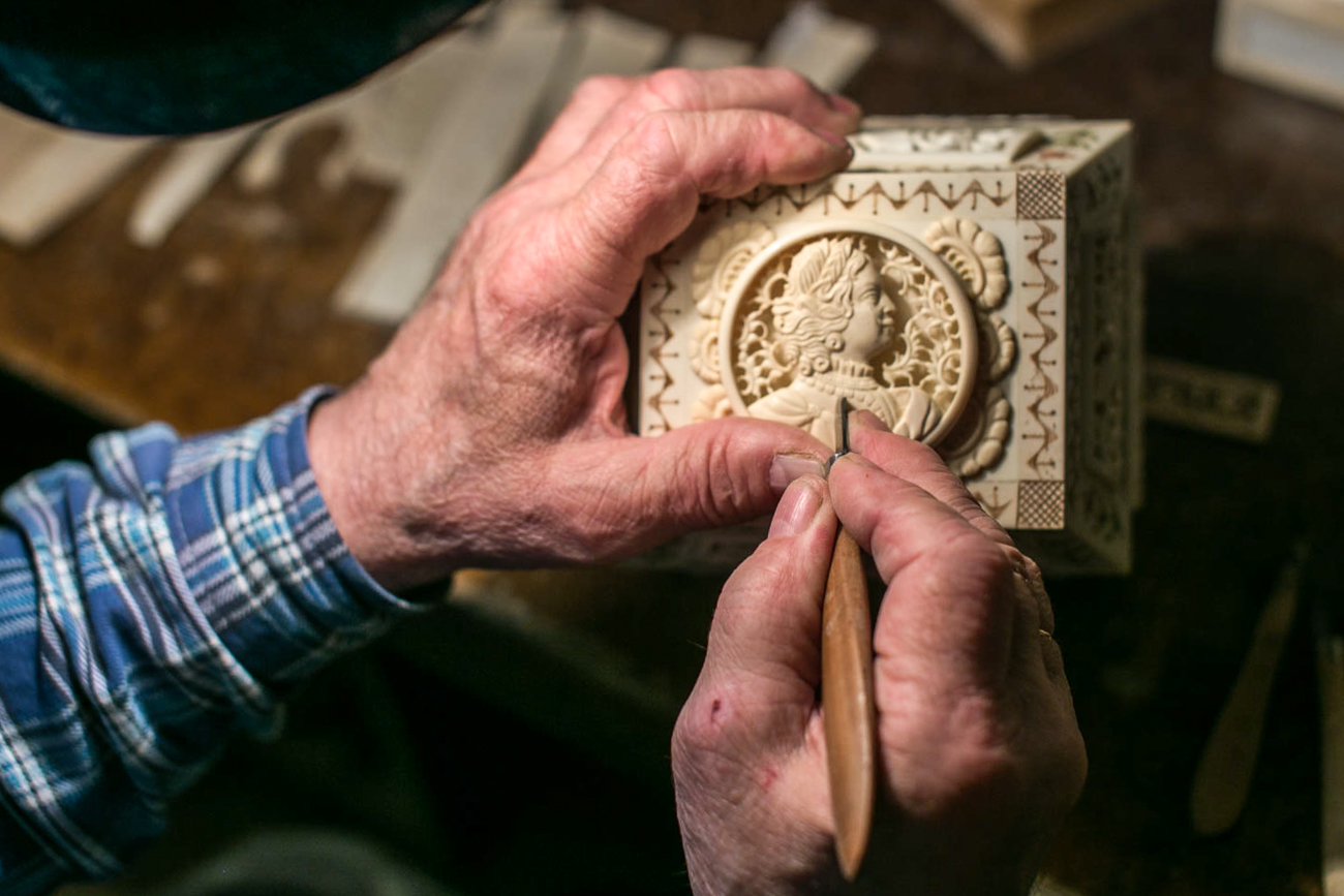 Nikolay Zachinyaev makes portraits out of mammoth tusks. One kilogram of this expensive raw material costs 30,000 rubles (about $500). A kilo is around he size of a fist, Zachinyaev says. A customer often pays for the mammoth bone in advance, he adds.