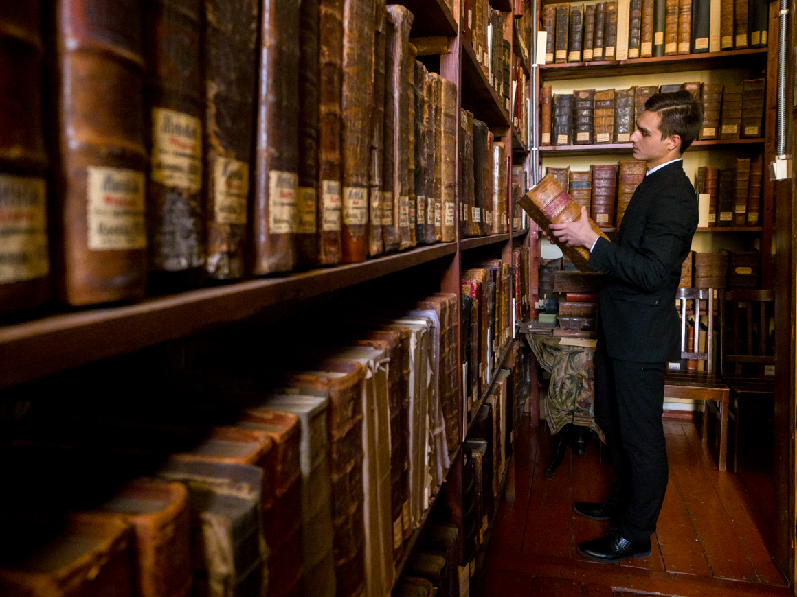 Student Vlad Grigorovich pictured in the library of the St. Petersburg Orthodox Theological Academy.