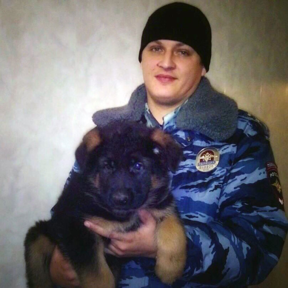 A handout picture released by Russian Interior Affairs Ministry shows a unnamed Russian policeman holding a German shepherd puppy named Dobrynya which Russia is sending to France in the cuddliest show of international solidarity possible to replace the French police dog Diesel, who was killed during an anti-terrorism raid on an apartment Wednesday, Moscow, Russia, 22 November 2015. 