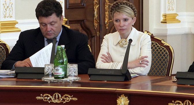 Zwei Spitzenkandidaten bei den Präsidentenwahlen in der Ukraine: der Schokoladen-König Pjotr Poroschenko (links) und ehemalige Premierministerin der Ukraine Julia Timoschenko (rechts). Foto: AP
