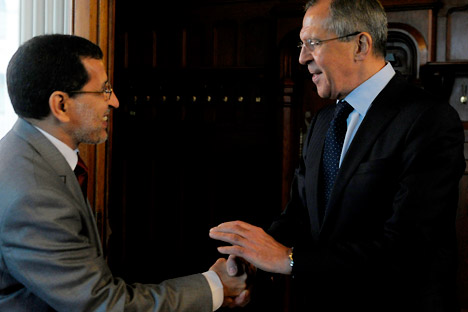 Russian Foreign Minister Sergey Lavrov, right, shakes hands with Morocco's counterpart Saadeddin al-Othmani in Moscow on Wednesday, April 18, 2012. Lavrov warned that only the U.N. Security Council has the authority to evaluate the fulfillment of Kof