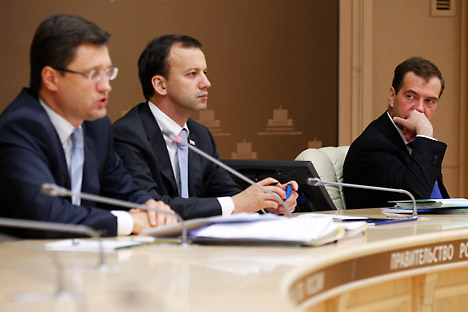 Russia's energy minister Alexander Novak, deputy prime minister Arkady Dvorkovich, and prime minister Dmitry Medvedev (L-R) at a video conference meeting of government officials. The meeting discussed issues related to the national central heating in