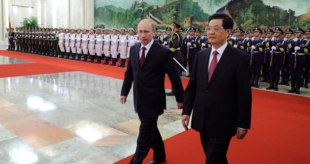 Vladimir Putin and Chinese President Hu Jintao finish reviewing an honor guard at the Shanghai Cooperation Organization summit in Beijing on Tuesday. Source: Reuters / Mark Ralston