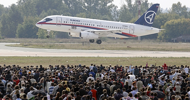 Visitors watch a Sukhoi Superjet 100 during the MAKS-2009 international air show in Zhukovsky outside Moscow. Source: Reuters / Vostock Photo