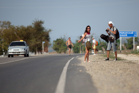 Hitchhiking is still widely accepted as a means of transportation in Russia. Source: PhotoEXpress.