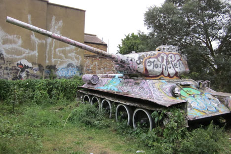 Just around the corner from the gallery, a genuine Russian T34 tank sits on a patch of overgrown wasteland. Source: Press Photo.