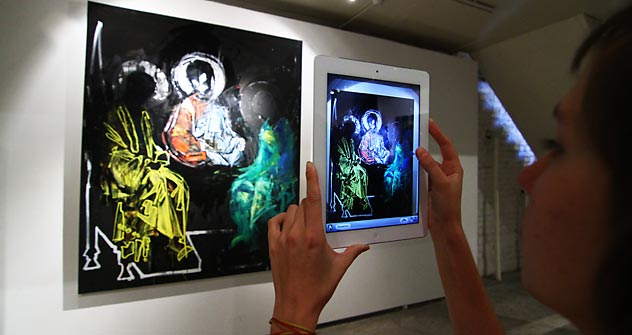 The "Spiritual Clash" exhibition presents “relevant icons” depicting  saints wearing balaclavas, portraits of the Pussy Riot members with halos, and a representation of the Savior with a female face. Source: ITAR-TASS