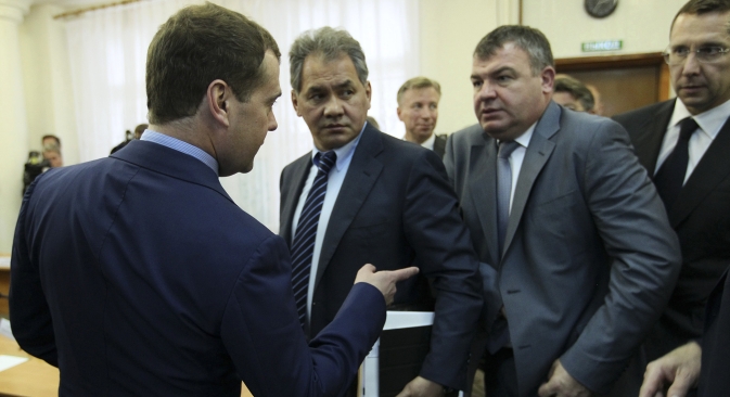 Dismissed Defense Minister Anatoly Serdyukov (second right) came under scrutiny over questionable contracts. Source: Reuters