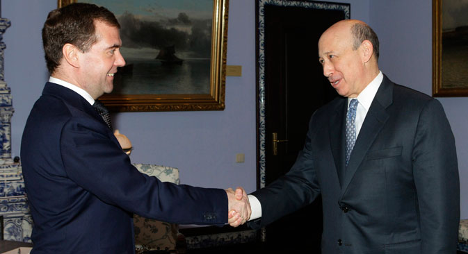 Russian President Dmitry Medvedev, left, shakes hands with Goldman Sachs Chief Executive Officer Lloyd Blankfein during a meeting in the Gorki residence outside Moscow, Tuesday, March 15, 2011. Source: AP Photo/RIA Novosti, Vladimir Rodionov