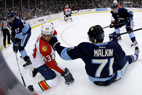 Pittsburgh Penguins center Evgeni Malkin (71) and Florida Panthers defenseman Mike Weaver (43) collide during the second period of an NHL hockey game in Pittsburgh Friday, Feb. 22, 2013. The Penguins won 3-1. Source: AP