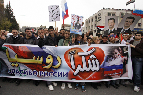 Citizens of Syria with the "Thank you Russia" poster. Source: AP