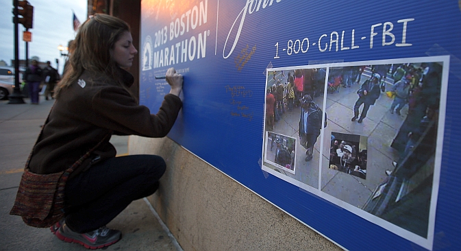 An American girl expressing her condolence to the victims of the Boston explosions. Source: Reuters