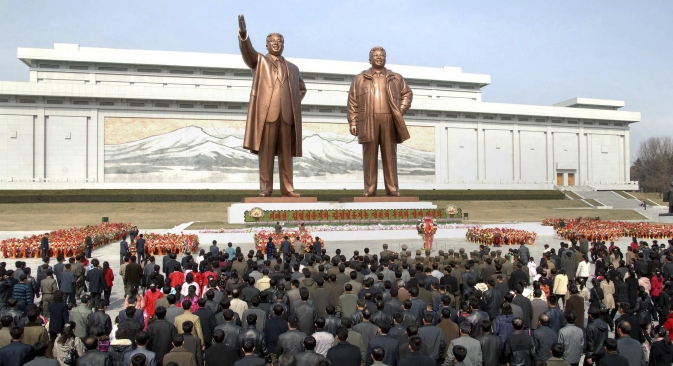 North Korean soldiers, workers and students place flowers before the statues of North Korean founder Kim Il-sung (left) and his son, late leader Kim Jong-il, on the 101st anniversary of Kim Il-sung's birth, in Pyongyang. Source: Reuters