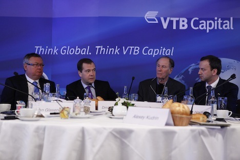 VTB Head Andrei Kostin (L) during the 2013 World Economic Forum. Pictured (L-R): Russia's Prime Minister Dmitry Medvedev, Co-founder of TPG David Bonderman and Deputy Prime Minister Arkady Dvorkovich. Source: ITAR-TASS 