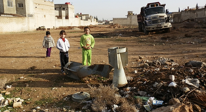 Moscow hopes that the 2013 G8 summit will contribute to tackling the Syrian standoff. Pictured: Children standing near the remnants of a bomb shell in the ground near Damascus. Source: Reuters