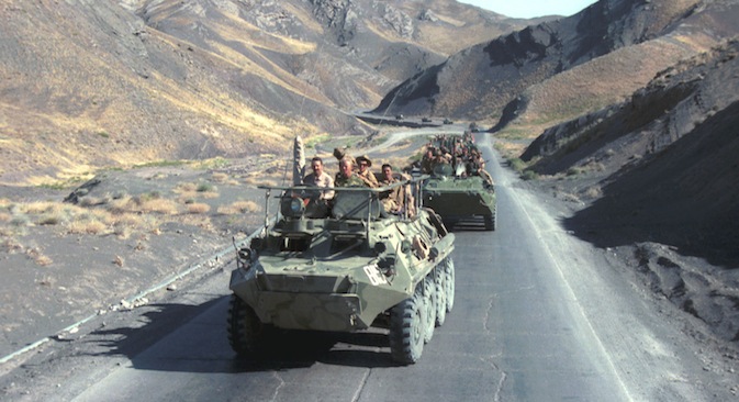 A column of armoured personnel vehicles rides on the way from Herat to Kushka as Soviet troops return home from Afghanistan in 1988. Source: ITAR TASS / Vladimir Zavyalov