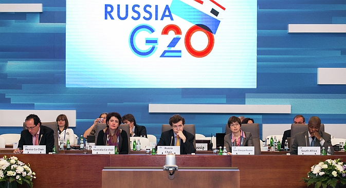 The G20 summit offers Russia both challenges and  opportunities. Pictured: Participants of a briefing at the Conference on the Russian Presidency in G20 "Fostering Economic Growth and Sustainability" held on Feb. 28. Source: G20 / Press Service