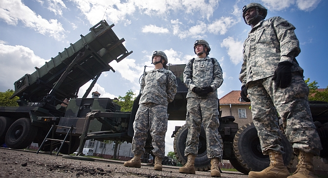 U.S. soldiers stand on May 26, 2010 in front of a Patriot missile battery at an army base in the northern Polish town of Morag. Source: AFP / East News