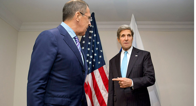 U.S. Secretary of State John Kerry gestures toward Russian Foreign Minister Sergey Lavrov (L), as he deflects a question from a reporter about whether they will discuss asylum for NSA leaker Edward Snowden, at the ASEAN summit in Brunei. Source: AP