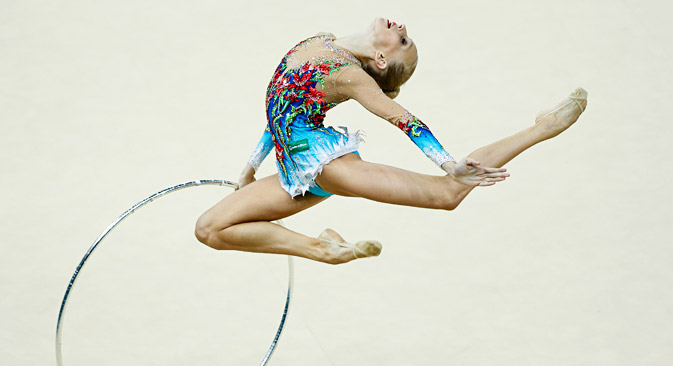 Yana Kudryavtseva performs with the hoop during the individual all-around competition final at the 32nd Rhythmic Gymnastics World Championships in Kiev August 30, 2013. Source: Reuters