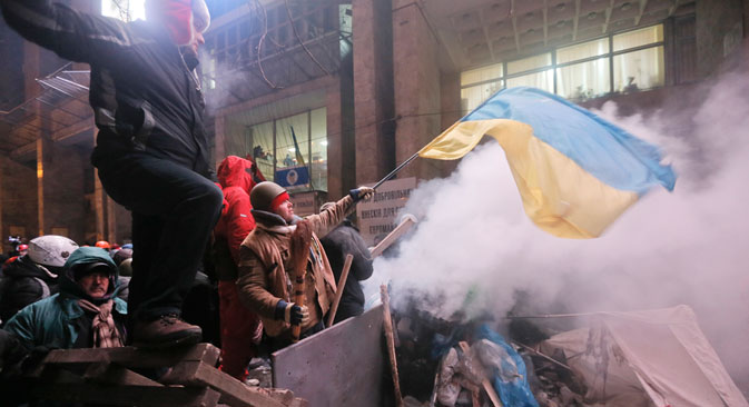 Identity crisis: pro-European protesters fly thenational flag in Kiev. Source: AP