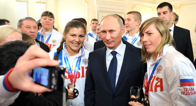 Many of the Americans in Sochi next month will have gotten there with charity, sponsorship cash and financial hardship. The Russians are there on the government’s dime. Pictured: Vladimir Putin (C) meets Russian athletes, the winners of the 2013 SportAccord World Combat Games, at Novo-Ogaryovo residence.Source: ITAR-TASS