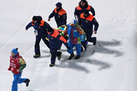 Mikhail Maksimochkin (Russia) lies on a stretcher after falling during a men's ski jumping large hill training session at the XXII Olympic Winter Games in Sochi. Source: Vitaliy Belousov / RIA Novosti