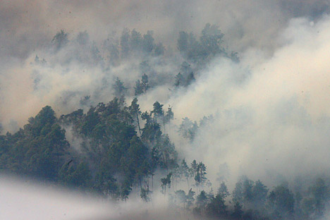 Smog from pit fires. Source: ITAR-TASS