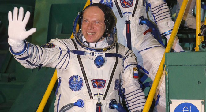 Oleg Kotov (bottom step), Mike Hopkins and Sergey Ryazanskiy about to embark on their 6-month stint on the space station. Source: RIA Novosti