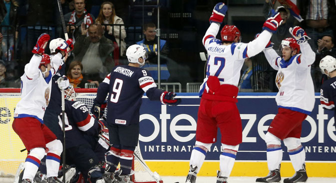 Russia players celebrate their opening goal during the Group B preliminary round match between Russia and USA at the Ice Hockey World Championship in Minsk. Source: AP