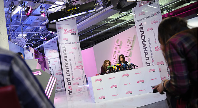 Pussy Riot punk band members Maria Alyokhina (L)and Nadezhda Tolokonnikova, freed from prison under an amnesty, give a press conference on Dozhd [Rain] TV channel. They were sentenced to two-year prison terms in July 2012 for offensive performance inside the Christ the Saviour Cathedral in February 2012. Source: Sergei Bobylev