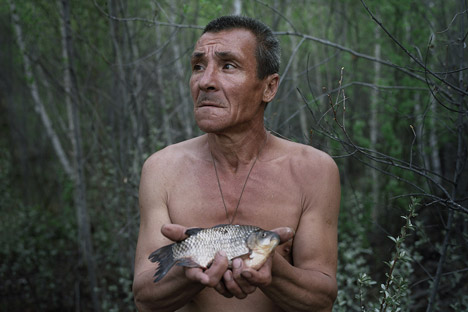  Tkachenko's series “Escape,” about hermits, took first place in the “Staged Portraits” category.