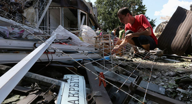 Ruined hopes: a bomb-damaged building in Donetsk, which has become a city under siege. Source: Reuters